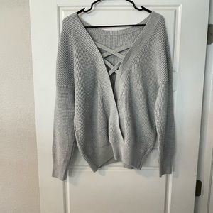 Knit sweater with cross semi open back